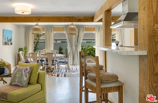 living room featuring concrete floors and a textured ceiling