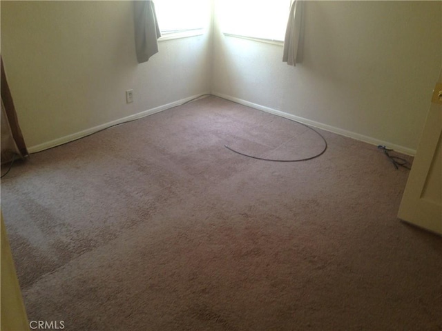 unfurnished room featuring carpet