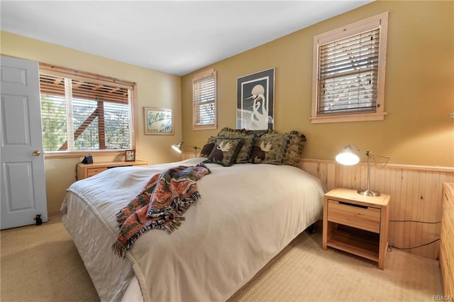 bedroom with light colored carpet