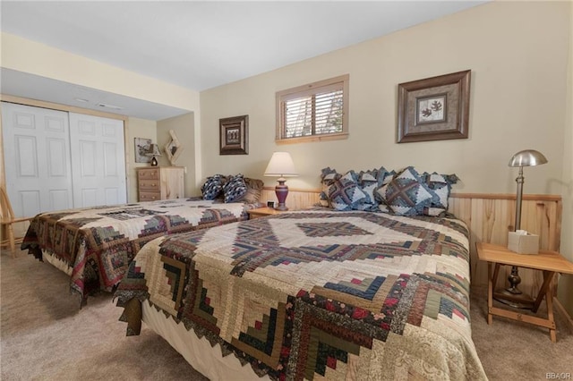 carpeted bedroom featuring a closet