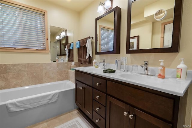 bathroom featuring dual sinks, tile floors, a bathtub, and oversized vanity