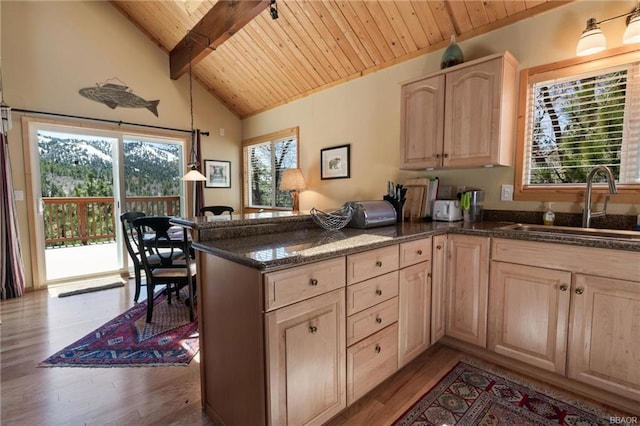 kitchen featuring wooden ceiling, light hardwood / wood-style flooring, kitchen peninsula, and hanging light fixtures