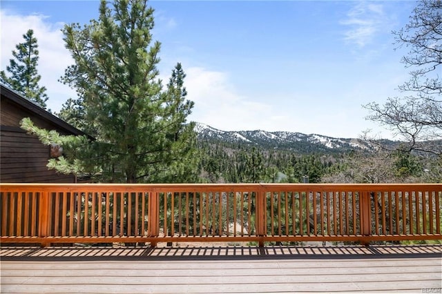 wooden deck with a mountain view