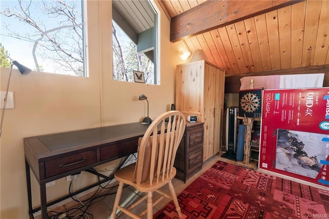 office space with vaulted ceiling with beams