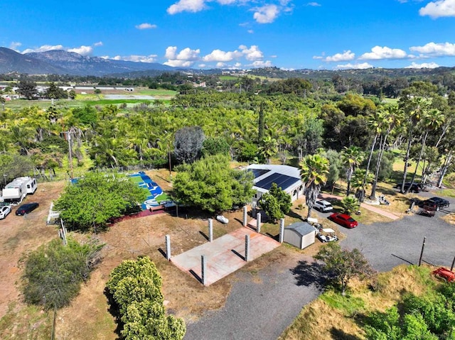 birds eye view of property featuring a mountain view