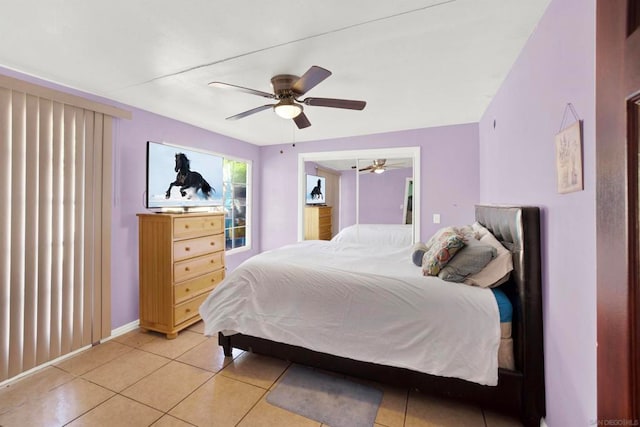 tiled bedroom with ceiling fan