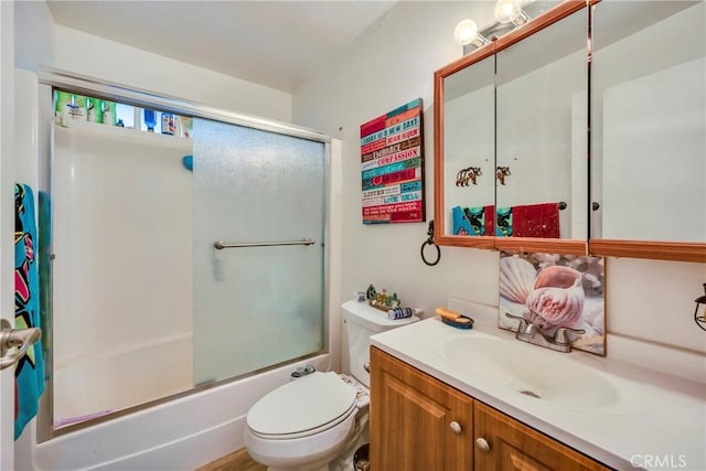 full bathroom featuring vanity, toilet, and enclosed tub / shower combo