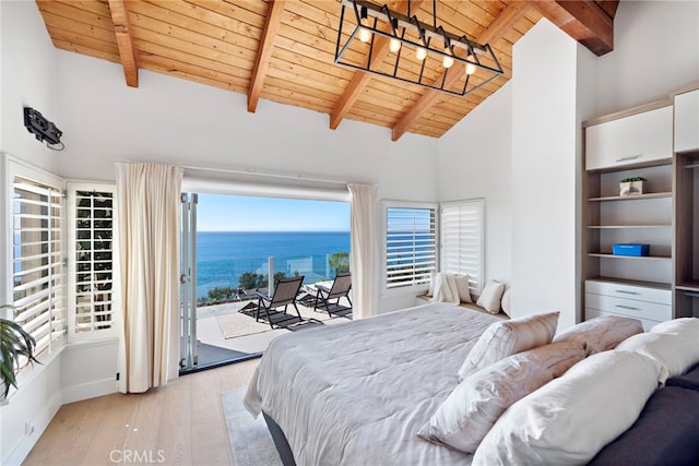 bedroom featuring access to outside, a water view, light wood-type flooring, beamed ceiling, and wood ceiling