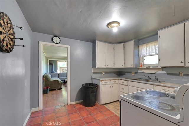 kitchen featuring white cabinets, tile patterned flooring, sink, and white electric stove