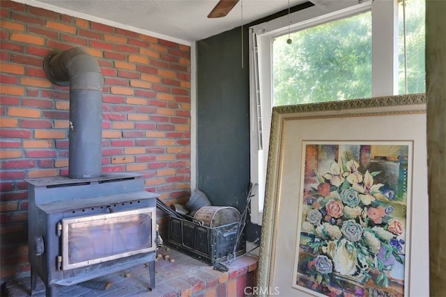 room details with ceiling fan and a wood stove