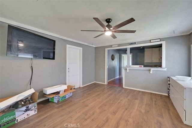 misc room featuring ceiling fan and hardwood / wood-style flooring