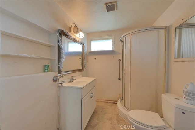 bathroom with vanity, toilet, and walk in shower