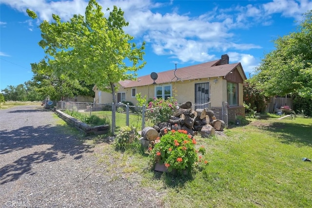 single story home with a front yard