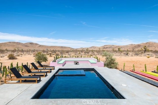 view of swimming pool featuring a mountain view