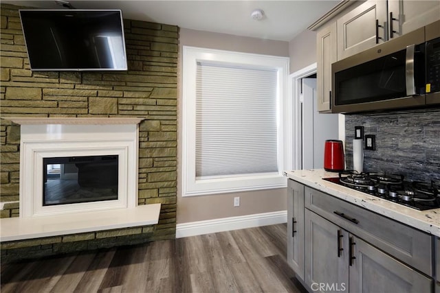 222 F St, Needles, CA 92363 - living area featuring baseboards and dark wood-type flooring