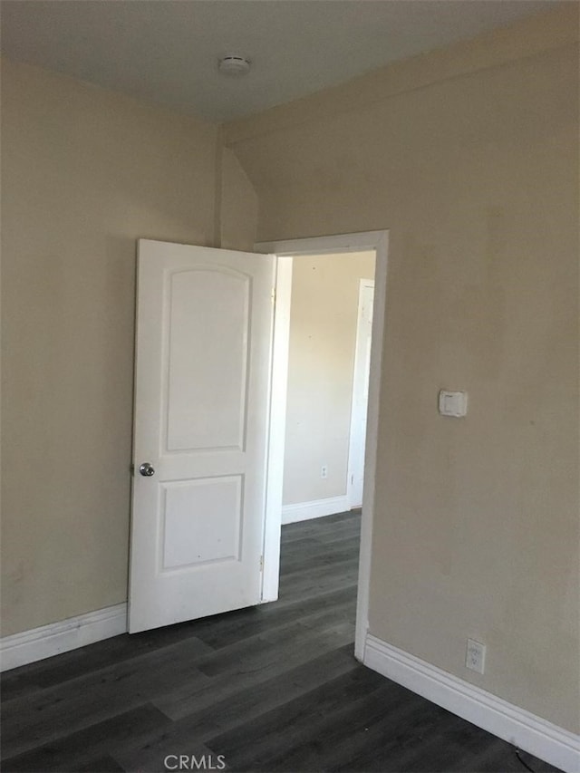 spare room featuring dark hardwood / wood-style floors