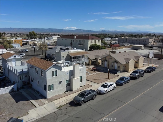 drone / aerial view featuring a mountain view