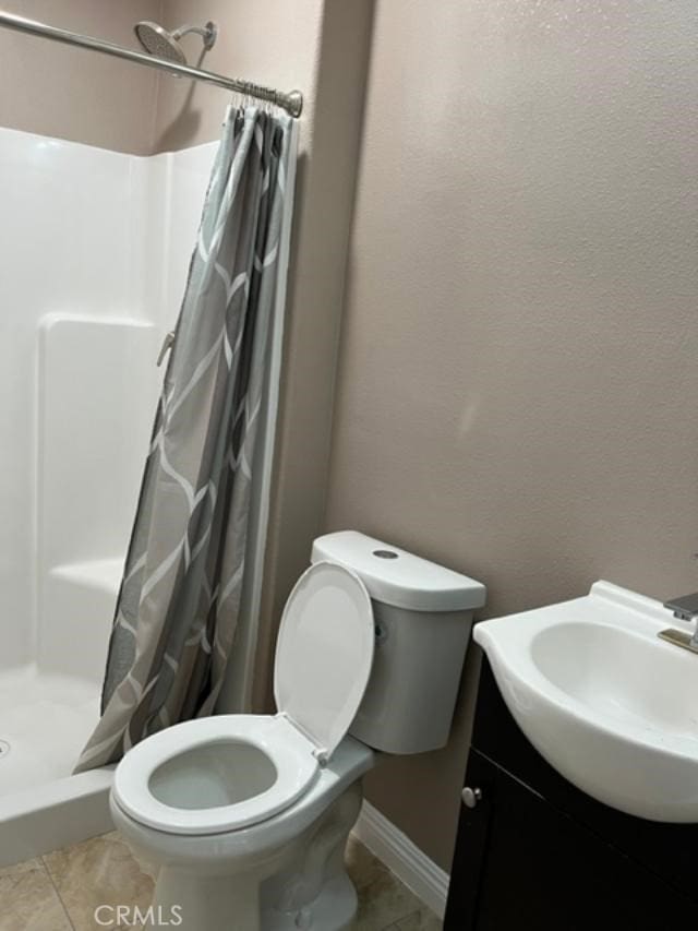222 F St, Needles, CA 92363 - full bath with toilet, a stall shower, vanity, and tile patterned floors