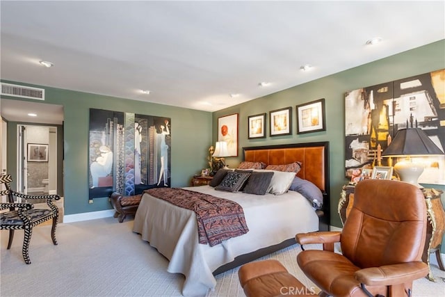 bedroom with visible vents, light carpet, and baseboards