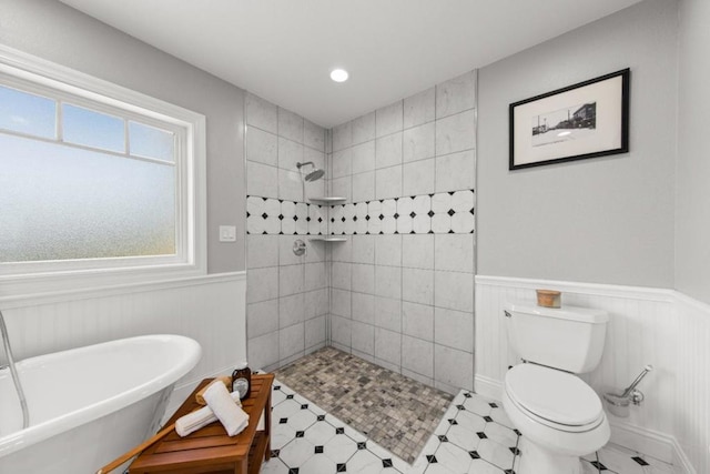 bathroom with toilet and shower with separate bathtub