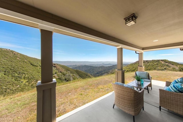 view of patio / terrace with a mountain view