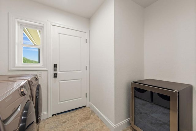 washroom featuring washer and clothes dryer