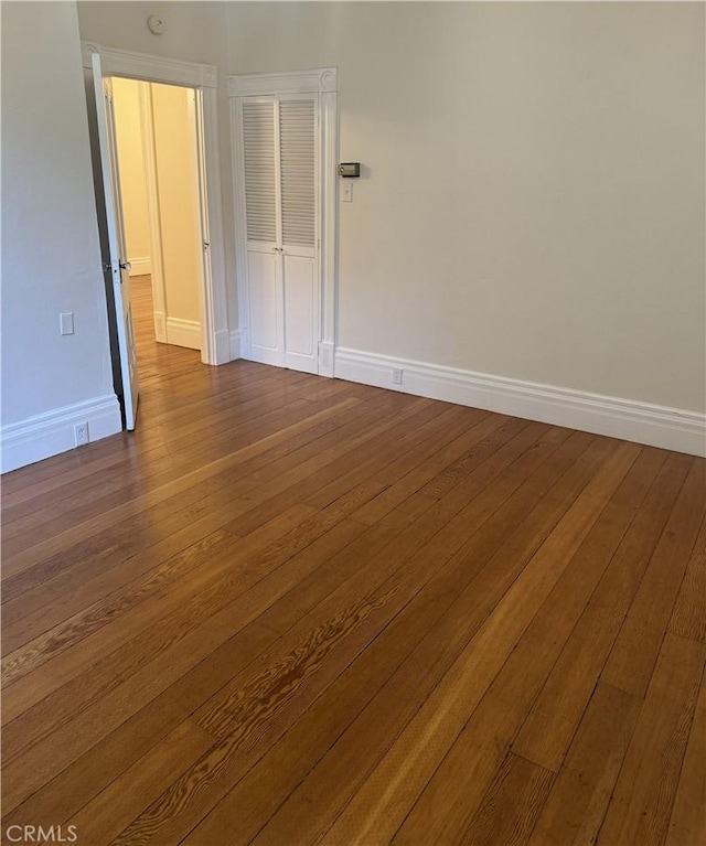 spare room featuring wood-type flooring