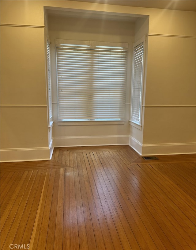 empty room featuring wood-type flooring