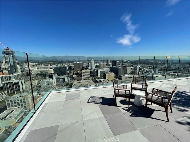 view of patio / terrace with a mountain view