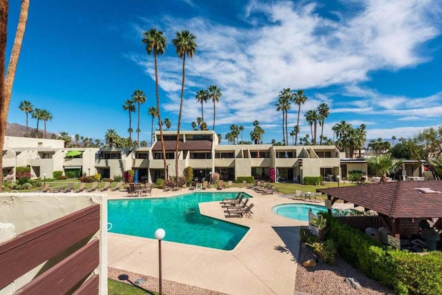 view of swimming pool featuring a patio area