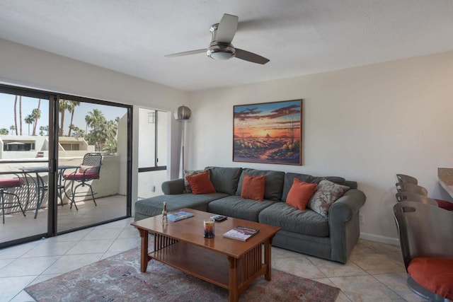 tiled living room with ceiling fan