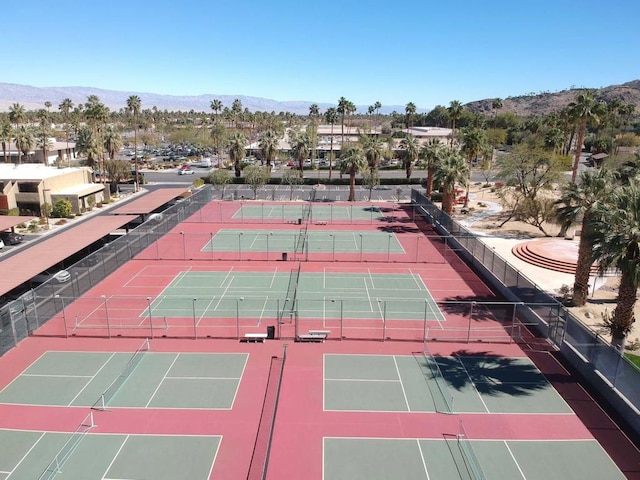 view of tennis court featuring a mountain view