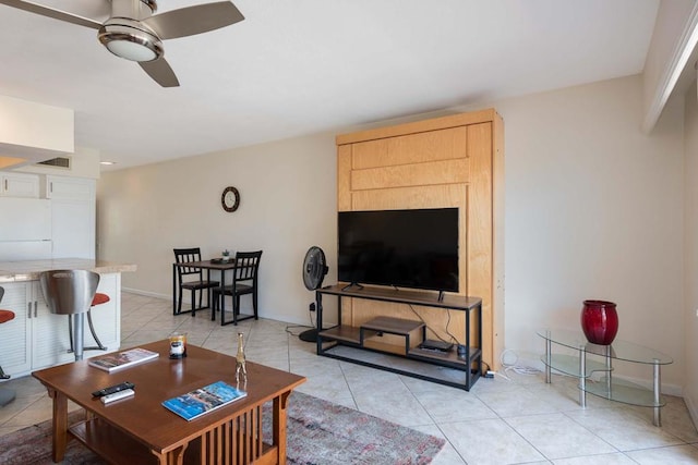 tiled living room featuring ceiling fan