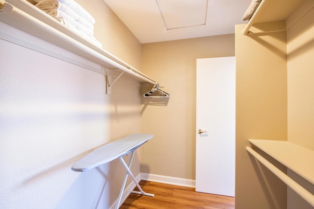 spacious closet featuring hardwood / wood-style floors