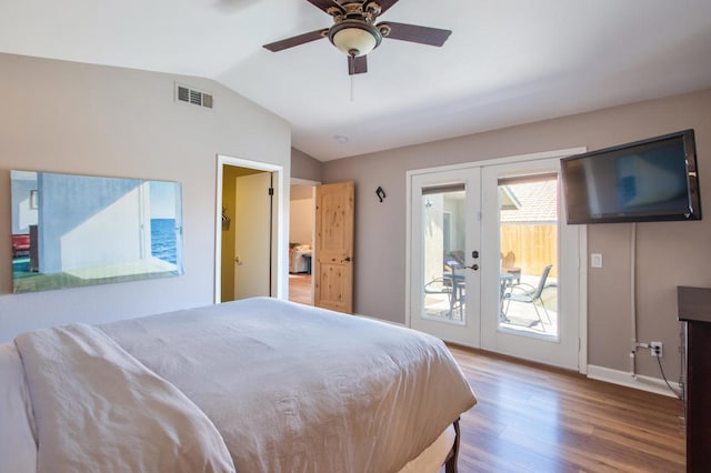 bedroom featuring access to exterior, french doors, vaulted ceiling, ceiling fan, and hardwood / wood-style floors