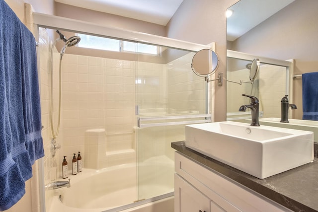 bathroom featuring vanity and enclosed tub / shower combo