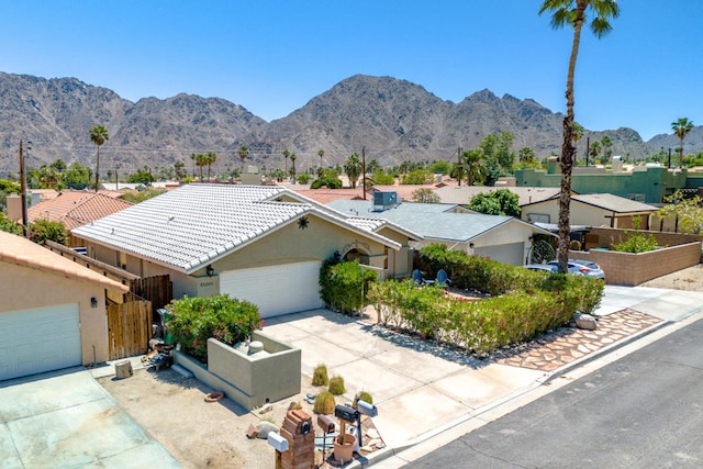 view of front of house featuring a mountain view and a garage