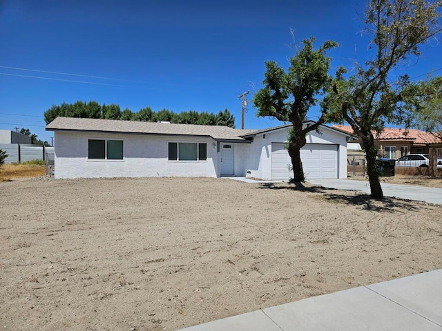 ranch-style home with a garage