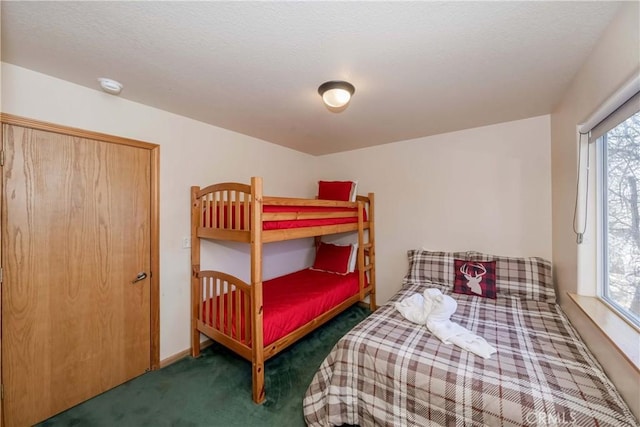 bedroom featuring dark carpet