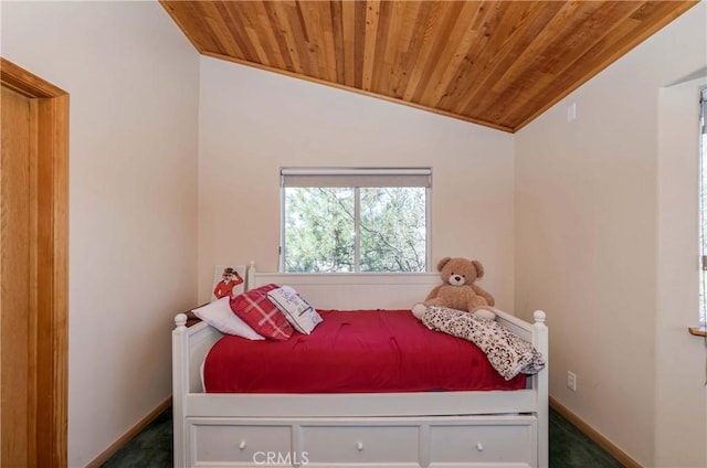 carpeted bedroom with vaulted ceiling and wood ceiling