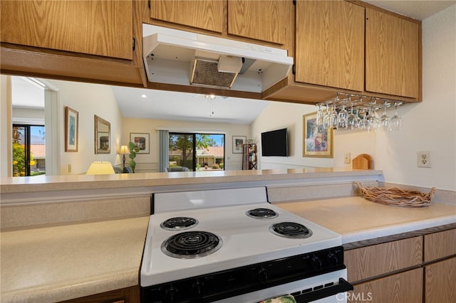 kitchen with vaulted ceiling and white electric range