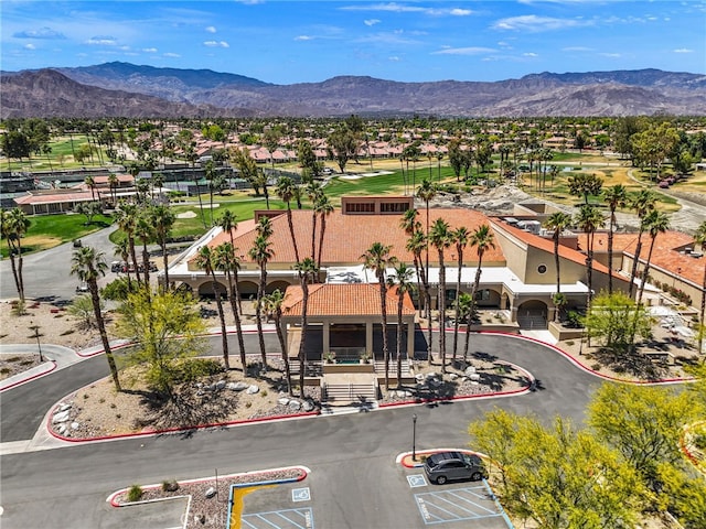 birds eye view of property with a mountain view