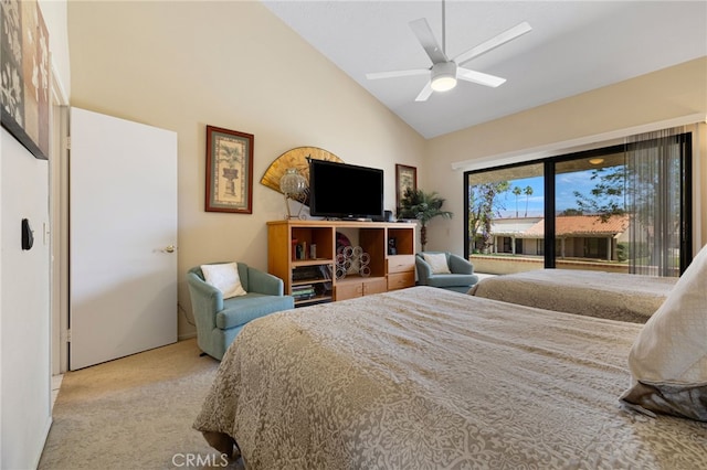 carpeted bedroom with ceiling fan and high vaulted ceiling