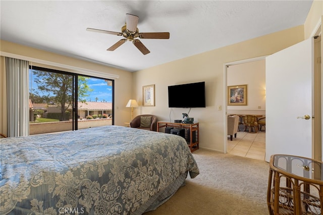 bedroom featuring access to outside, light colored carpet, and ceiling fan