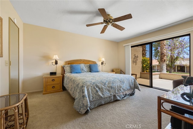 carpeted bedroom featuring access to exterior and ceiling fan