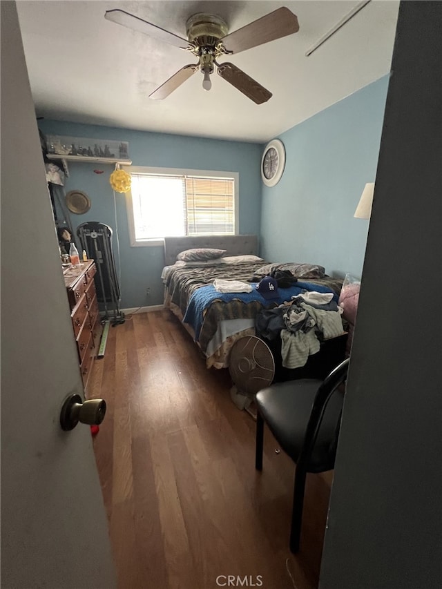 bedroom featuring ceiling fan and hardwood / wood-style floors