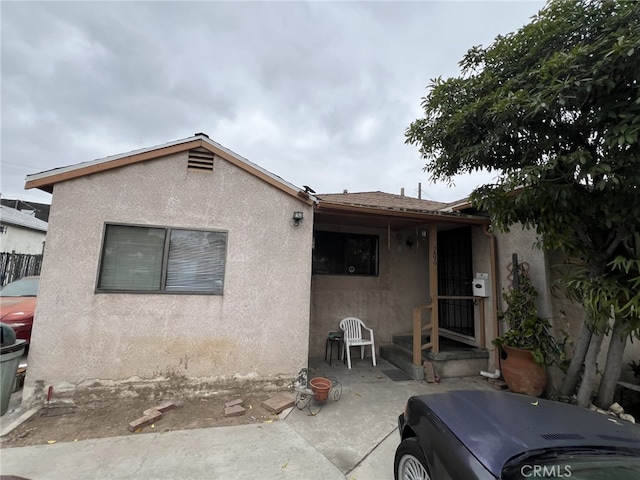 back of property featuring a patio