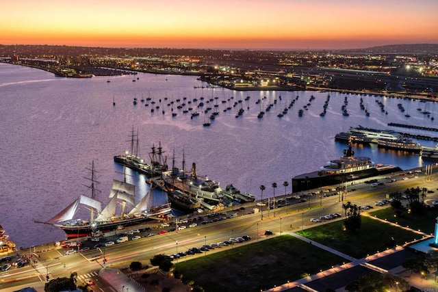 aerial view at dusk with a water view