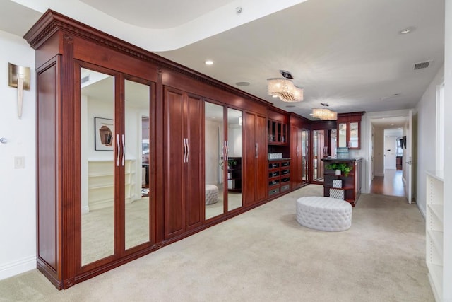 unfurnished room with light colored carpet