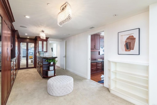 interior space with french doors and light carpet